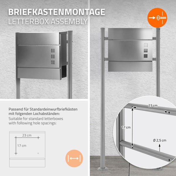Montage eines Briefkastens auf Edelstahl-Standfuß mit 23 Zentimeter mal 17 Zentimeter Lochabstand und 2,5 Zentimeter Rohrdurchmesser.