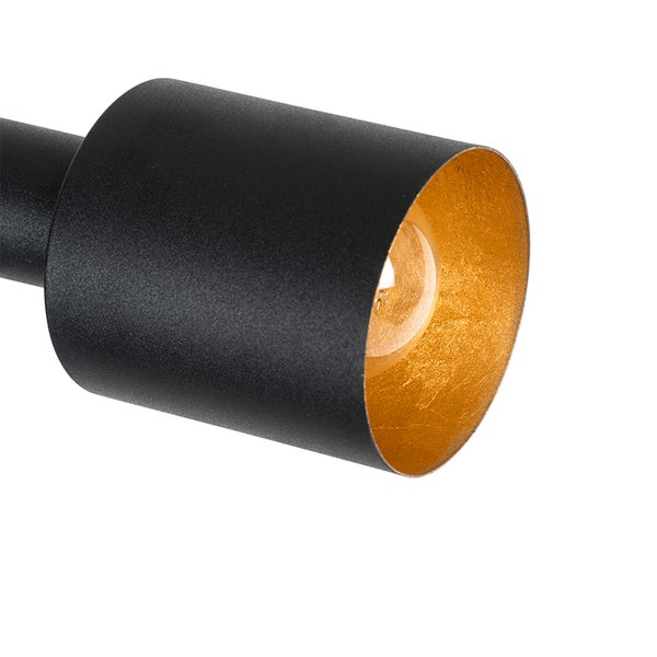 Schwarze Lampe mit goldfarbener Innenseite