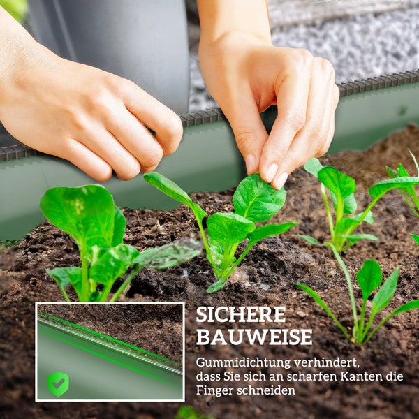 Stabiles und rostbeständiges Hochbeet aus Metall in einem Garten mit rosa Blumen, einfach zu montieren und pflegeleicht.