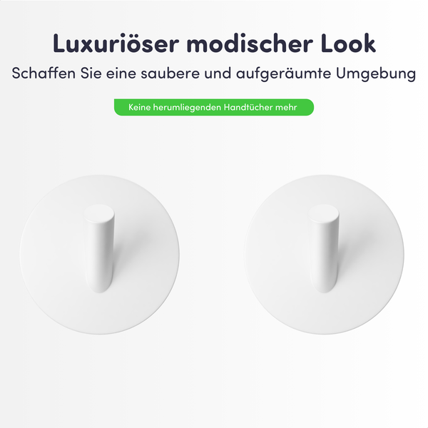 Zwei runde weiße Handtuchhaken für die Wandmontage zur organisierten Aufbewahrung von Handtüchern.