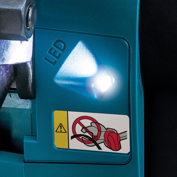 Detailaufnahme einer LED-Leuchte und eines Warnhinweises auf einem Werkzeug
