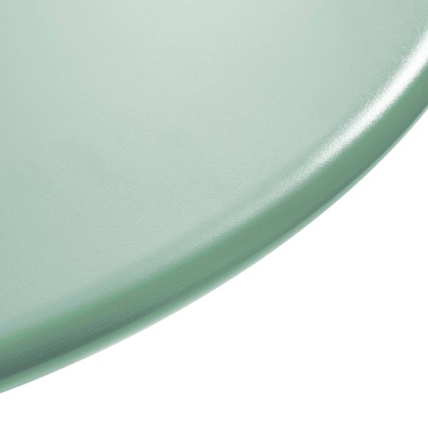 Detailaufnahme einer glatten, leicht strukturierten grünen Oberfläche mit abgerundeter Kante.