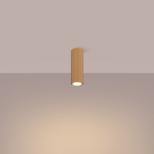 Zylinderförmige Deckenleuchte mit gerillter Oberfläche.