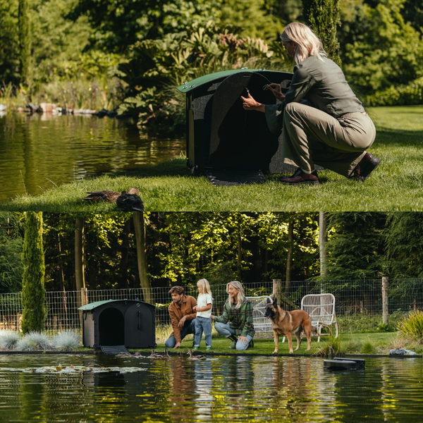 Entenhaus aus Kunststoff mit grünem Dach und Rampe am Teichufer mit Enten.
