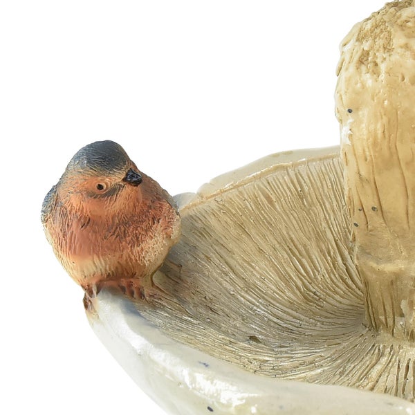 Dekorative Pilzfigur mit Vogel