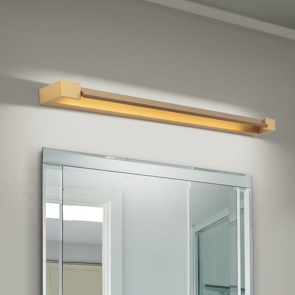 Moderne längliche LED Spiegelleuchte für Badezimmer zur Wandmontage über einem Wandspiegel.