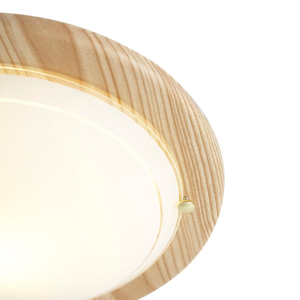 Detailaufnahme einer runden Deckenleuchte mit Rand in Holzoptik und Diffusor