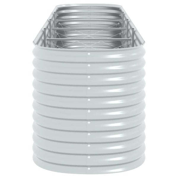 Gartenlounge mit Kissen und Decke auf einer Holzpalette