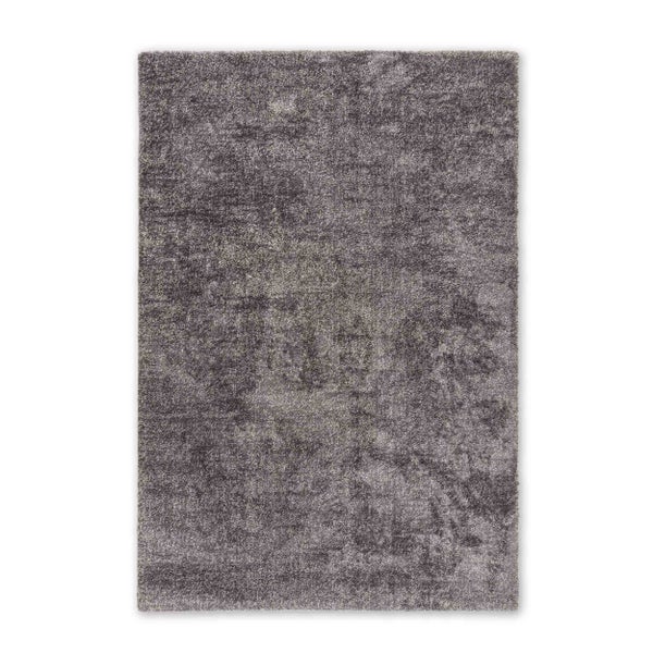 Rechteckiger grauer Hochflor-Teppich mit weicher Oberfläche.