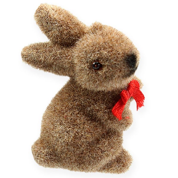 Dekorativer Osterhase mit roter Schleife