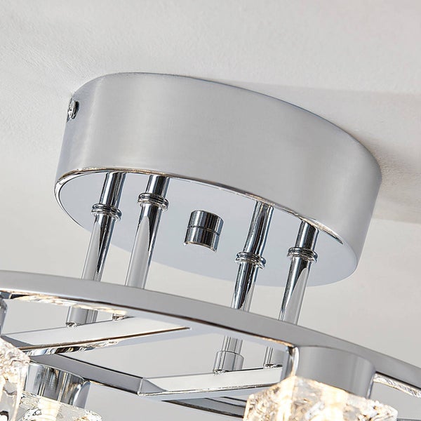 Nahaufnahme eines runden Deckenleuchten-Baldachins aus Chrom mit vertikalen Verbindungsstangen.