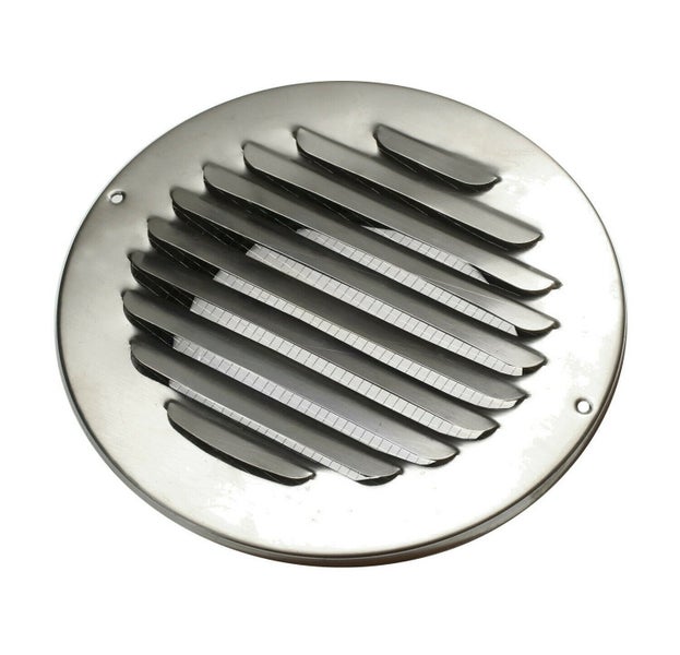 Rundes Lüftungsgitter aus Edelstahl mit Lamellen und zwei Befestigungslöchern.