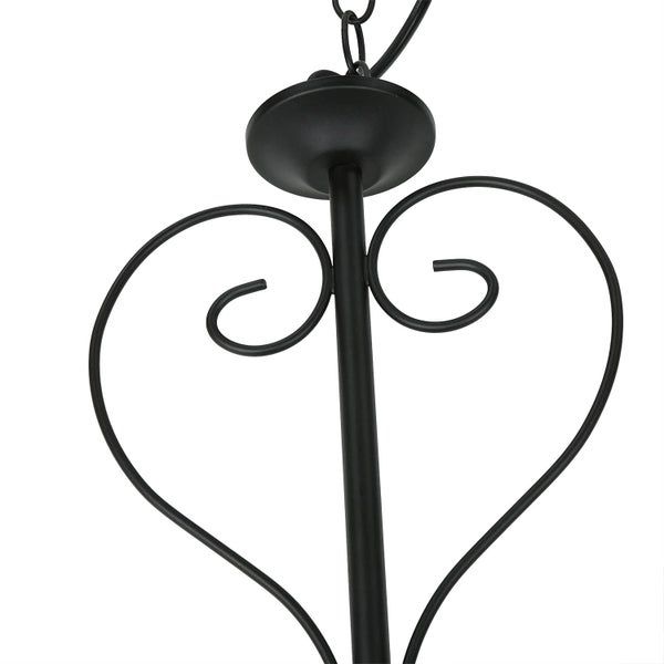 Detailaufnahme einer Pendelleuchte mit herzförmigen Ornamenten.