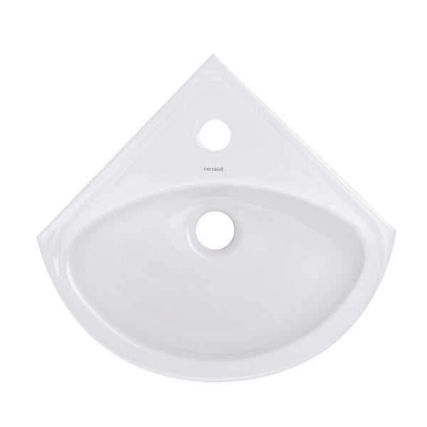 Weißes Eckwaschbecken von Cersanit aus Keramik mit einem Hahnloch und einem Abflussloch.