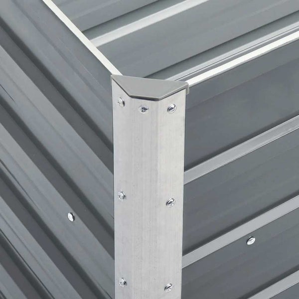 Eckverbindung eines Hochbeets aus Metall mit Wellblechpaneelen, Schrauben und Schutzkappe.
