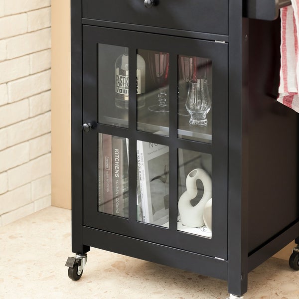 Detailansicht eines schwarzen Küchenwagens mit Glasvitrine und Rollen