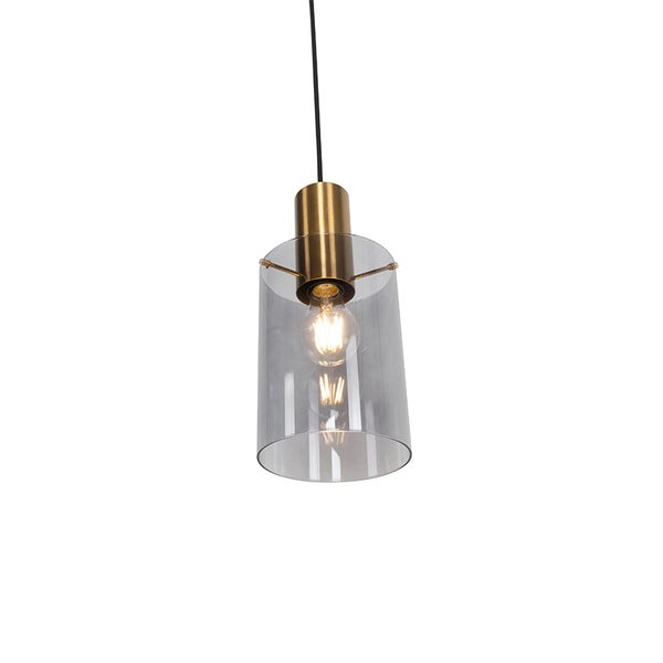 Moderne Hängeleuchte mit zylindrischem Schirm aus Rauchglas und einer messingfarbenen Metallfassung, inklusive sichtbarem Leuchtmittel.