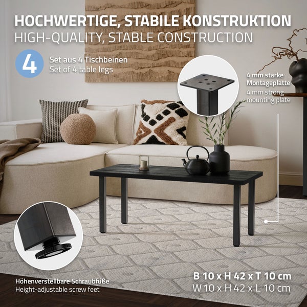 Set aus vier schwarzen Tischbeinen mit 4 Millimeter starken Montageplatten und höhenverstellbaren Füßen an einem Couchtisch in einem Wohnzimmer.