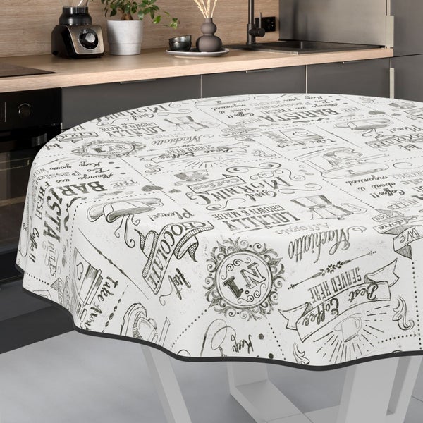 Runde Tischdecke mit Kaffeemotiven auf einem Tisch in einer Küche