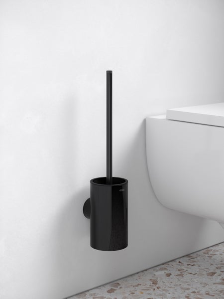 Wandmontierte KEUCO WC-Bürstengarnitur in modernem Design neben einer weißen Toilette.