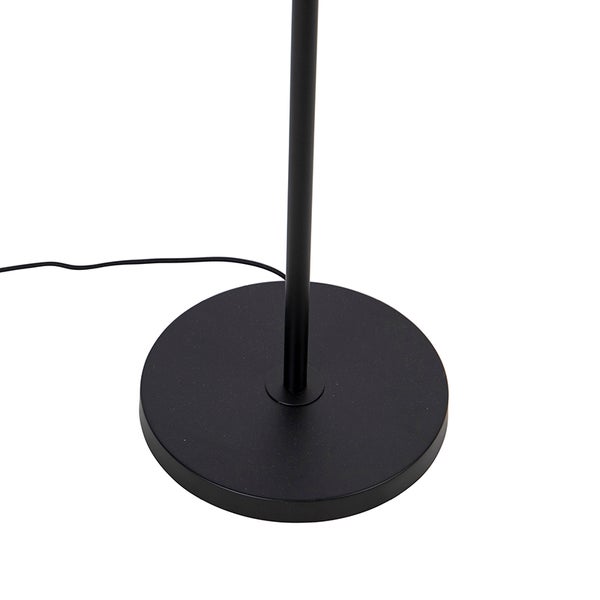 Detailaufnahme eines schwarzen Lampenfußes.