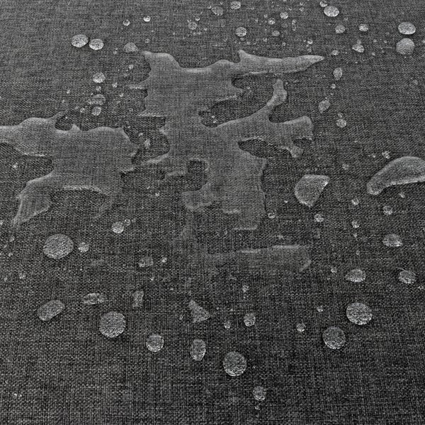 Wasserabweisender Stoff mit Wassertropfen auf der Oberfläche, die den Abperleffekt zeigen.