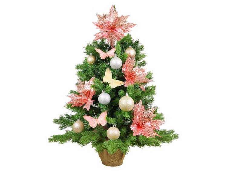 Geschmückter künstlicher Weihnachtsbaum mit Weihnachtskugeln und Blumenornamenten im Jutetopf als festliche Tischdekoration.
