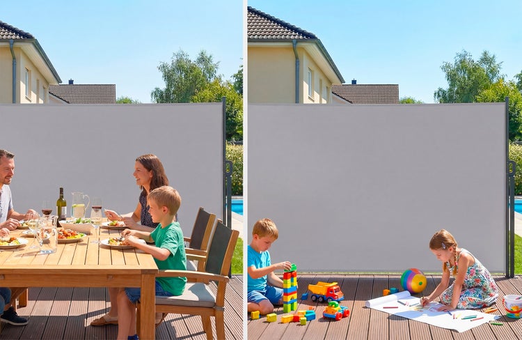 Graue Seitenmarkise als Sichtschutz und Windschutz auf einer Terrasse mit Esstisch und spielenden Kindern.