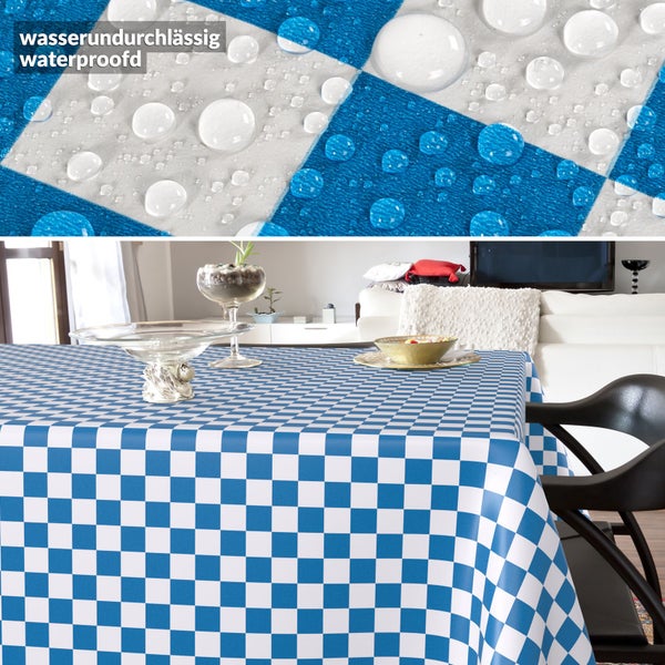 Wasserundurchlässige, karierte Tischdecke in einem hellen Wohnzimmer, mit einer Detailansicht von Wassertropfen auf der Oberfläche.