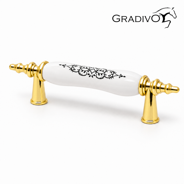 Möbelgriff mit goldfarbenen Metallenden und weißem Keramikgriff mit schwarzem Ornamentmuster. Gradivo Logo.