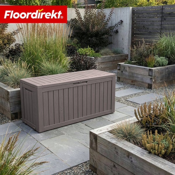 Aufbewahrungsbox aus Kunststoff im Garten mit Bepflanzung und Floor direkt Logo.