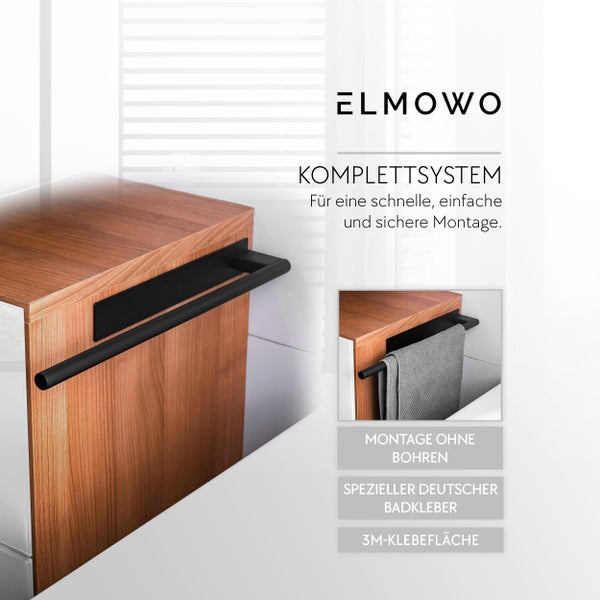 ELMOWO Handtuchhalter zur Montage ohne Bohren mit speziellem Badkleber und drei M Klebefläche an einem Holzschrank im Badezimmer montiert.