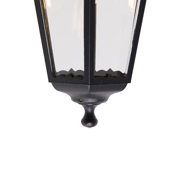 Detailansicht der Unterseite einer klassischen Außenwandleuchte aus Metall mit Glaseinsätzen und dekorativem Abschluss.