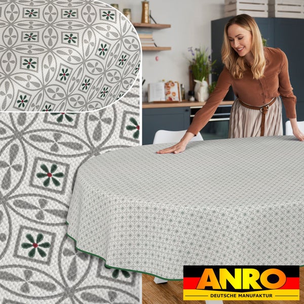 Frau legt Wachstuch Tischdecke mit Blumenmuster auf Tisch, ANRO Logo