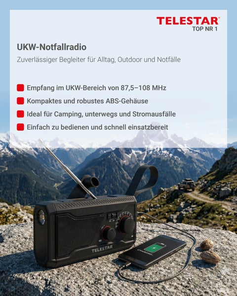 Telestar UKW Notfallradio mit Teleskopantenne und Ladefunktion fuer Smartphones in Gebirgslandschaft.