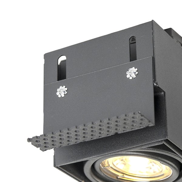 Einbaustrahler, schwarz, quadratisch, Metall, Detailansicht mit Montagehalterung und gelochtem Metallstreifen.
