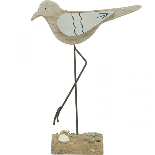 Dekofigur Vogel aus Holz mit Metallelementen auf Sandsockel mit Muscheln