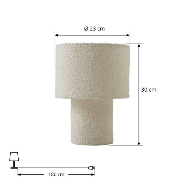 Tischleuchte aus Bouclé-Stoff mit Maßen. Durchmesser 23 Zentimeter, Höhe 30 Zentimeter und Kabellänge 180 Zentimeter.