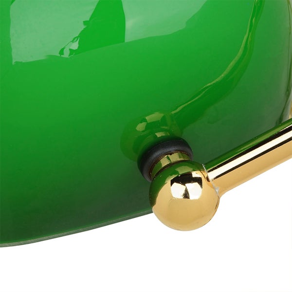 Detail einer Bankerlampe mit grüner Lampenschirm und goldenem Gestell
