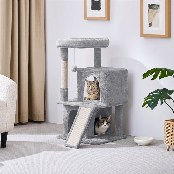 Grauer Katzenkratzbaum mit zwei Katzen in einem hellen Raum