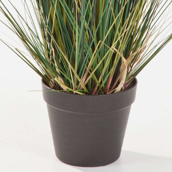 Künstlicher Magnolienzweig mit einer großen weißen Blüte und mehreren geschlossenen Knospen an braunen Zweigen.