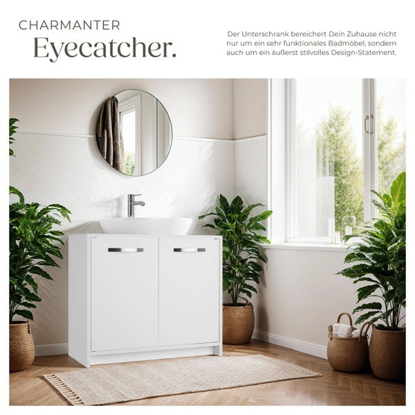 Ein moderner Badezimmerunterschrank mit zwei Türen und Aufsatzwaschbecken in einem hellen Badezimmer mit Pflanzen und rundem Spiegel.