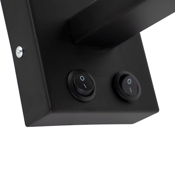 Detailaufnahme einer schwarzen Lampe mit zwei Schaltern.