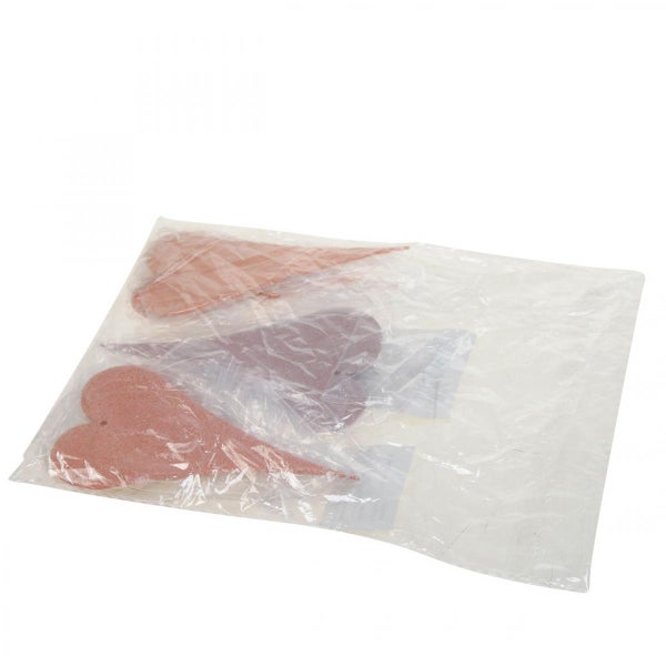 Dekorative Herzanhänger in einer Verpackung