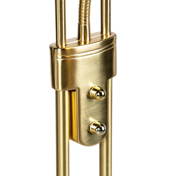 Detailaufnahme einer goldenen Stehlampe mit zwei Schaltern zur Bedienung.