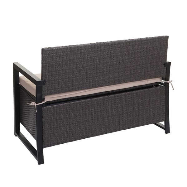 Rückansicht einer anthrazitfarbenen Gartenbank aus Polyrattan mit Metallgestell, Sitzkissen und integriertem Stauraum.