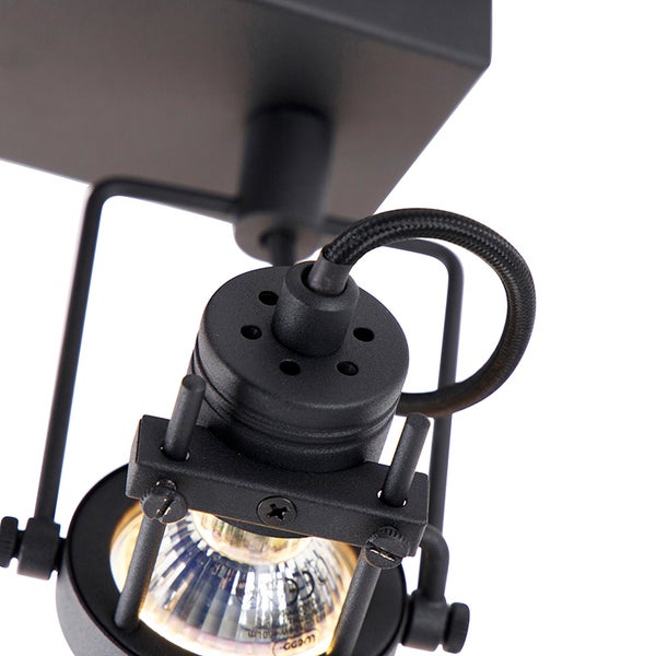 Nahaufnahme einer schwarzen Deckenleuchte mit Spot