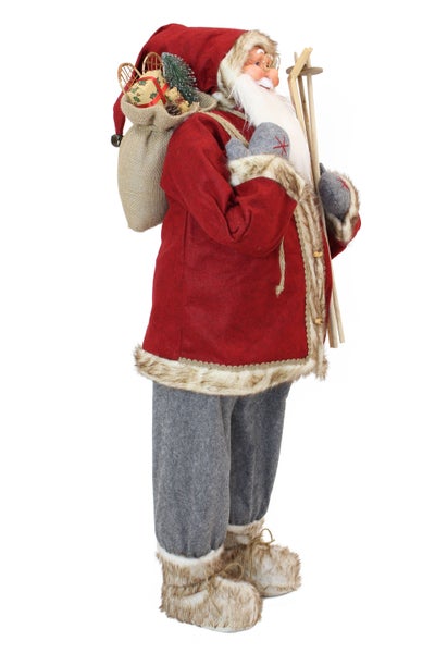 Dekorativer Weihnachtsmann mit Geschenkesack und Skiern