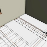 Verlegung einer Fussbodenheizung mit Dämmplatten in einem Raum