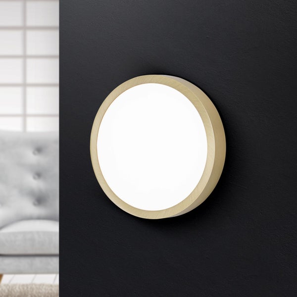 Runde Wandleuchte mit LED auf schwarzer Wand